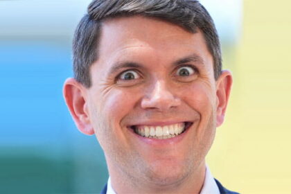 Male Democrat Texas politician James Talarico wearing a suit and smiling.