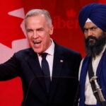 Canada Prime Minister Mark Carney standing next to an Indian Sikh man wearing a turban on stage.