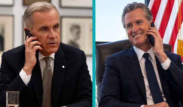 Canada male prime minister Mark Carney on the phone talking to California Governor Gavin Newsom on the phone.