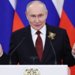 Russia President Vladimir Putin wearing suit behind a podium speaking on plague bacteria outbreak.