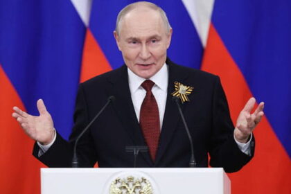 Russia President Vladimir Putin wearing suit behind a podium speaking on plague bacteria outbreak.